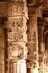 Carved Stone Pillar (column) Qutub Minar in The tallest minaret in India is a marble and red sandstone tower that represents the beginning of Muslim rule in the country, New Delhi, India