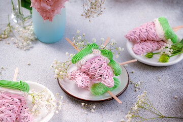 Stack of delicious homemade colorful marshmallows in the form of slices of watermelon on a gray background