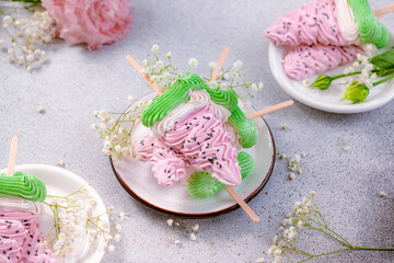 Stack of delicious homemade colorful marshmallows in the form of slices of watermelon on a gray background