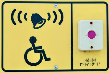 signs in Braille with a button to call staff