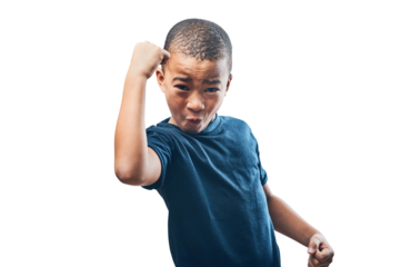 Happy boy, portrait and fist in celebration for achievement standing isolated on a transparent PNG background. Little child, kid or teen in celebrate, winning or power for success, prize or bonus