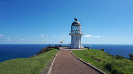Cape Reinga lighthouse on the coast of the sea in New Zealand