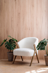 New comfortable chair against wooden wall at lounge room © brizmaker