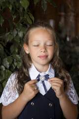Portrait primary schoolgirl, in school uniform.