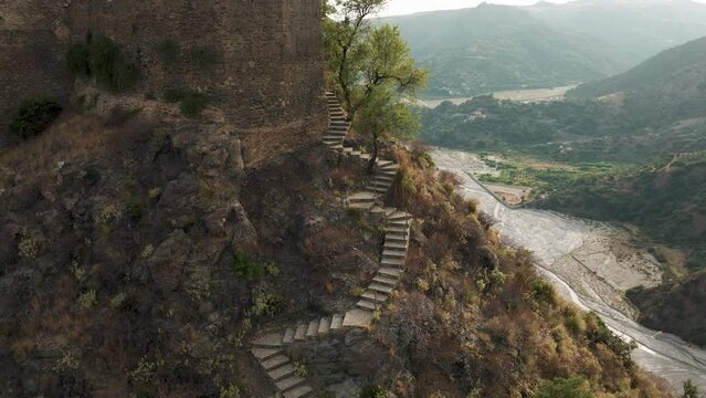 Ancient ruins of a medieval castle on top of the mountain. Amendolea Castle. 