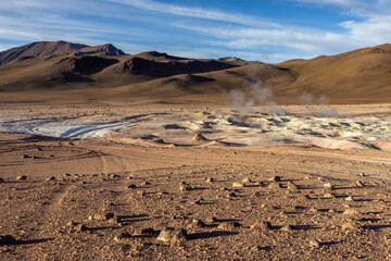 Stunning geothermic field of Sol de Mañana with its steaming geysers and hot pools with bubbling...