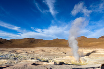 Stunning geothermic field of Sol de Mañana with its steaming geysers and hot pools with bubbling mud - just one sight on the lagoon route in Bolivia, South America 