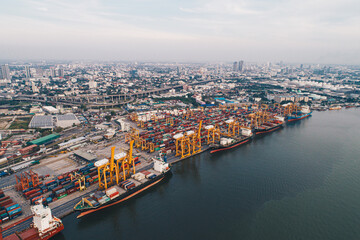 Obraz premium Aerial view shipping crane boat city habour port with container truck city view background