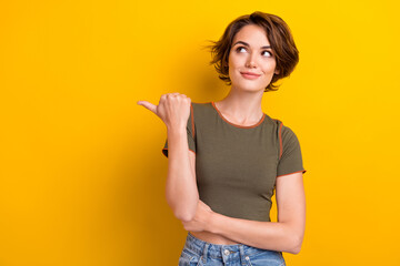 Portrait of satisfied optimistic gorgeous woman wear khaki top directing look at promo empty space...