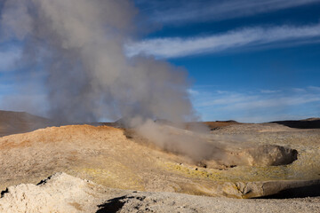 Stunning geothermic field of Sol de Mañana with its steaming geysers and hot pools with bubbling mud - just one sight on the lagoon route in Bolivia, South America