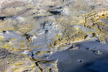 Stunning geothermic field of Sol de Mañana with its steaming geysers and hot pools with bubbling mud - just one sight on the lagoon route in Bolivia, South America