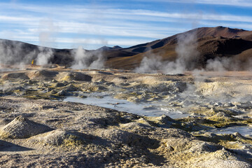 Stunning geothermic field of Sol de Mañana with its steaming geysers and hot pools with bubbling mud - just one sight on the lagoon route in Bolivia, South America