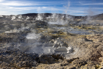 Stunning geothermic field of Sol de Mañana with its steaming geysers and hot pools with bubbling mud - just one sight on the lagoon route in Bolivia, South America