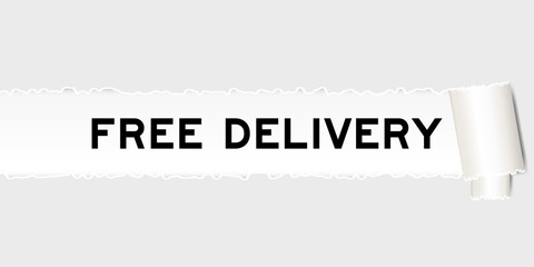 Ripped gray paper background that have word free delivery under torn part