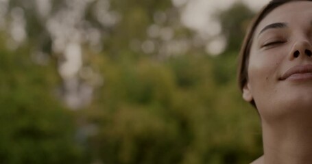 Relaxed woman breathing fresh air outdoors - Powered by Adobe