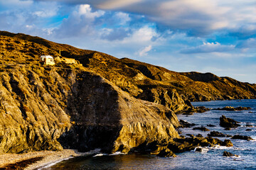 Camper van on coast cliff in Spain.