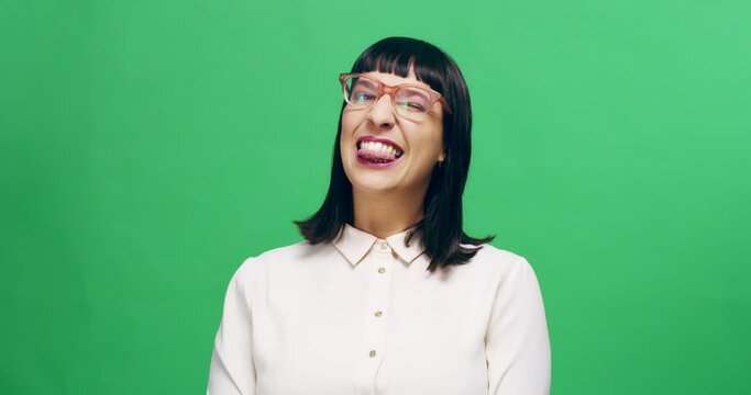 Tongue out, wink and woman face on green screen studio for silly, goofy and nerd expression on mockup background. Space, portrait and emoji portrait by lady person with geek personality or gesture