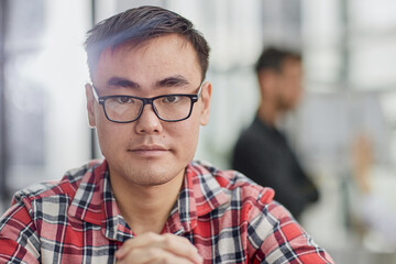 Fototapeta premium a successful businessman in a shirt sits at a table with folded hands.