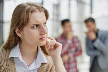 Concentrated thoughtful young experienced Indian business woman looking at computer monitor