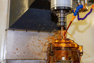 The CNC milling machine cutting the shell mold parts with oil coolant method .