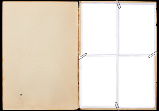 A vintage book page with blank photo frames attached with paper clips.