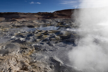Stunning geothermic field of Sol de Mañana with its steaming geysers and hot pools with bubbling mud - just one sight on the lagoon route in Bolivia, South America