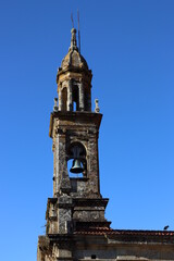 Fototapeta na wymiar Bell tower of the church of Santa Comba, in Carnota, La Coruña, Spain. Upright image.