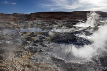 Obraz premium Stunning geothermic field of Sol de Mañana with its steaming geysers and hot pools with bubbling mud - just one sight on the lagoon route in Bolivia, South America