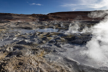 Stunning geothermic field of Sol de Mañana with its steaming geysers and hot pools with bubbling mud - just one sight on the lagoon route in Bolivia, South America