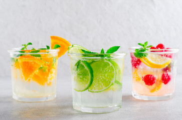Summer Drinks Set, Fruit, Citrus and Berry Refreshing Lemonade or Cocktails on Bright Background