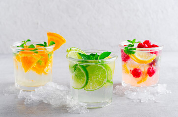 Summer Drinks Set, Fruit, Citrus and Berry Refreshing Lemonade or Cocktails on Bright Background