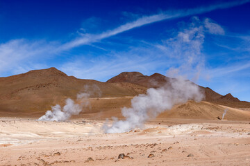 Stunning geothermic field of Sol de Mañana with its steaming geysers and hot pools with bubbling mud - just one sight on the lagoon route in Bolivia, South America