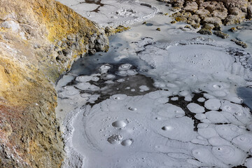 Stunning geothermic field of Sol de Mañana with its steaming geysers and hot pools with bubbling mud - just one sight on the lagoon route in Bolivia, South America