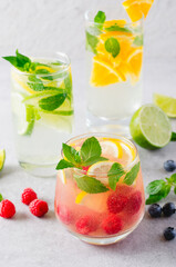 Summer Drinks Set, Fruit, Citrus and Berry Refreshing Lemonade or Cocktails on Bright Background