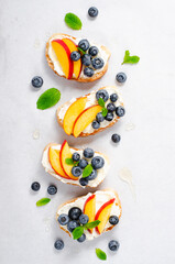 Homemade Toast with Blueberry, Peach and Cream Cheese, Delicious Summer Snack or Breakfast