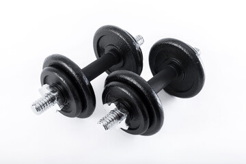 Obraz na płótnie Canvas dumbbell and metal weights isolated on white background.