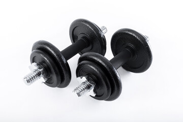Fototapeta premium dumbbell and metal weights isolated on white background.