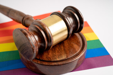 Gavel for judge lawyer on rainbow flag, symbol of LGBT pride month celebrate annual in June social of gay, lesbian, bisexual, transgender, human rights.