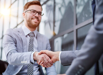 Business people shaking hands, finishing up meeting