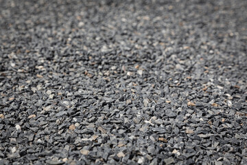 Wallpaper picture of gray granite pebbles floor with a blurred background for graphic design work