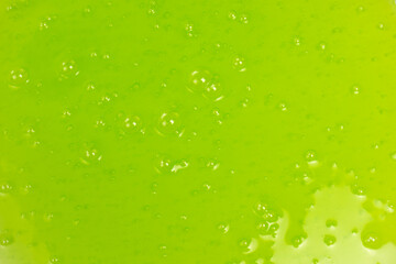 Green slime toy as a background.