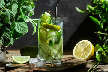 Cold lemonade with lime and cucumber .Cocktail