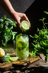 Cold lemonade with lime and cucumber .Cocktail
