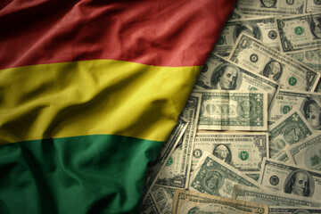 colorful waving national flag of bolivia on a american dollar money background. finance concept