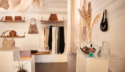 Interior of stylish clothing boutique with accessories on display