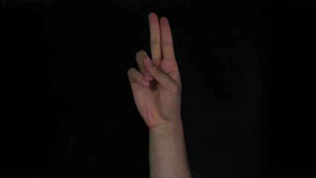 U u alphabet American sign language video demonstration in HD, American Sign Language (ASL) single-handed u U letter sign isolated on black background.
