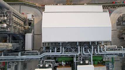 Top view of factory roof .Cooling tower of factory, technology, and engineering concept. © naraichal