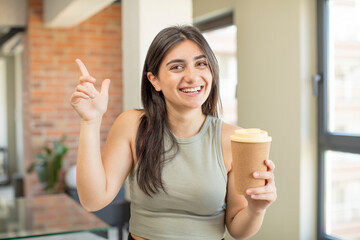 young woman feeling like a happy and excited genius after realizing an idea. take away coffee