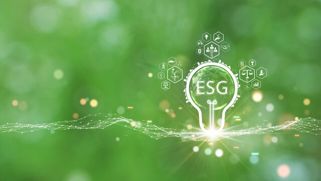 Environmental Social and Governance (ESG). Modern investment concept that takes account the sustainable natural environment. Lightbulb icon with globe and ESG inside, over polygon on green background.