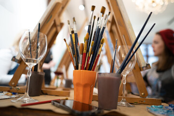 close-up of many brushes of an artist in an art studio